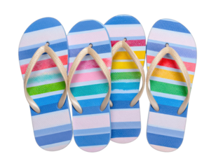 Close-up of four colorful striped flip-flops with beige straps against a black background