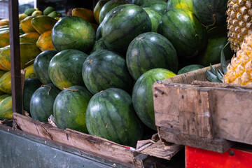Watermelons for sale at a fruit stand in Sri Lanka.