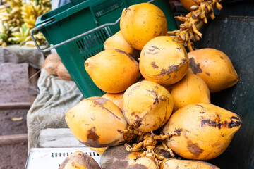 A bunch of king coconuts at a street fruit stand in Sri Lanka. A natural drink in a coconut.