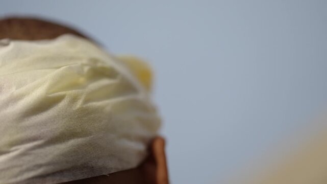 Close-up video of a human head with bandage after injury, showing scalp dressing, first aid care, and medical recovery in a healthcare context.