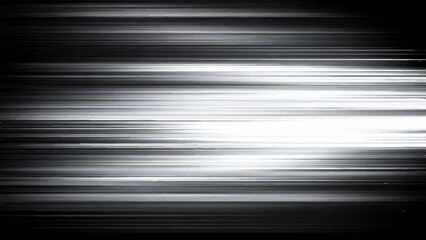 Obraz premium Blurry white light streaks on black background