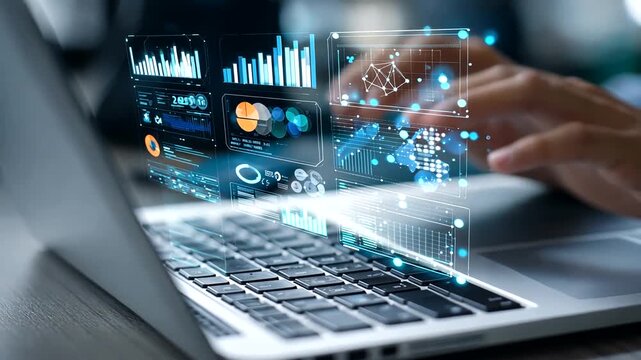Person working on laptop with digital data and charts projected over the screen, analyzing business insights.