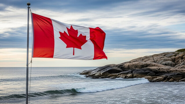 Canadian flag waving proudly by the ocean with rocky coastline views