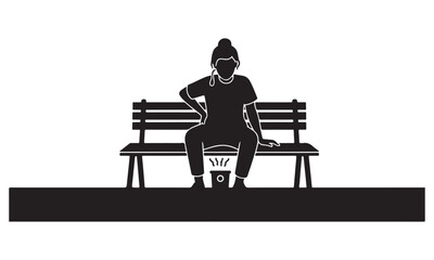 Woman sitting on a bench with portable heater on her lap