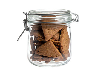 Triangular cookies fill a clear glass jar