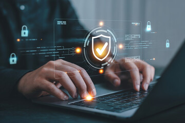 Cybersecurity concept with businessman working on laptop and virtual lock icon image