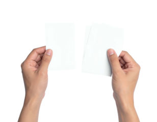 Hands holding blank white cards against black background