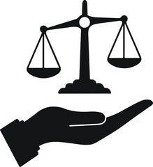 Hand holding scales of justice