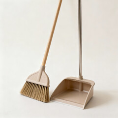 Broom and Dustpan with Copy Space on Clean Minimal Background