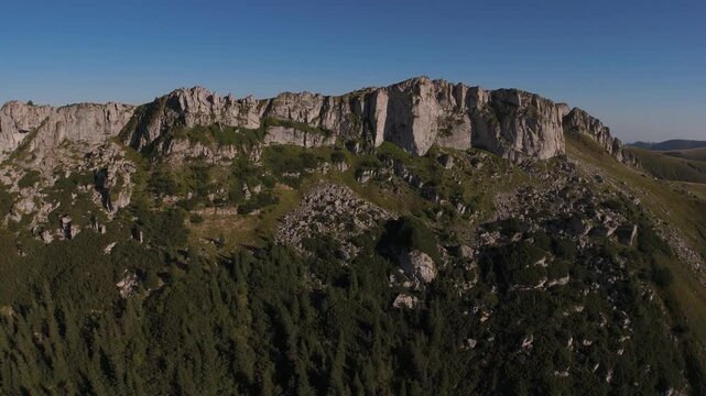 Strungile Mici Peaks Aerial Lateral Flight to Rotation Revealing Detailed Limestone Rock Formations in Bucegi Mountains