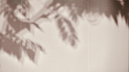 Wide horizontal view of foliage silhouettes on fabric texture, interior design background