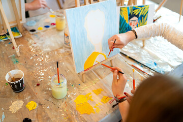 Fototapeta premium Mother and child painting artwork at family workshop