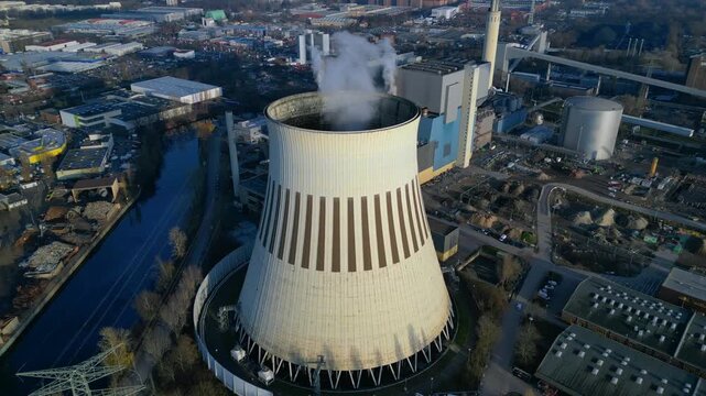 Hard Coal power plant cooling tower emitting steam. Unique aerial view drone