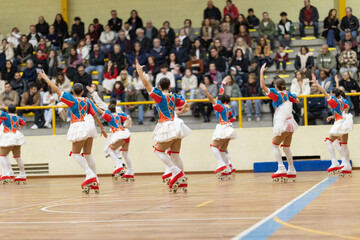 Athletes performing artistic roller skating routine