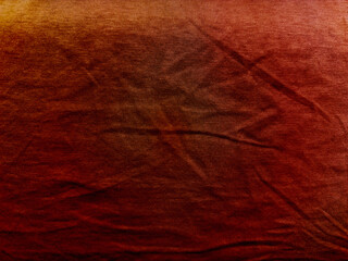 warm rusty red fabric texture gradient with subtle folds and wrinkles evokes earthy autumn mood abstract background ideal for wallpaper or design banner with copy space