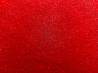 vibrant crimson fabric texture closeup captivates with subtle speckles and warm glow against soft blue borders offering versatile banner copy space and wallpaper appeal