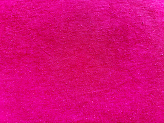 vibrant hot pink textured fabric closeup with pastel blue copy space for banner wallpaper or editorial background