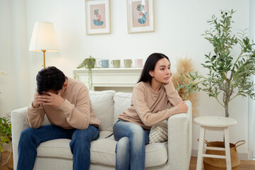 Quarrel Between Asian Couple Revealing Issues of Infidelity and Emotional Distance in a Cozy Setting