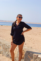 portrait of young woman in sunglasses on the beach in Red Sea Egypt	