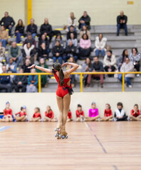 Young skater performing artistic roller skating routine