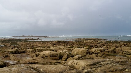 storm over the sea with a lighthouse in windy weather