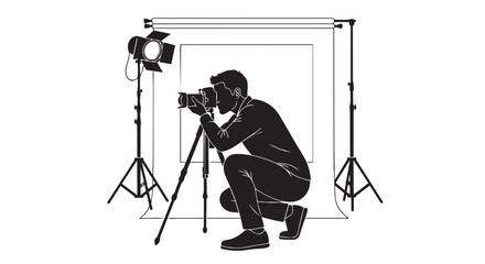 Silhouette of photographer crouching with camera on tripod in studio setup