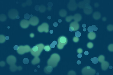 An abstract deep blue background illuminated by soft teal and green bokeh lights