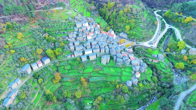 Piodao historic schist village on slope of Serra do Acor mountains in central Portugal. Aerial view. Orbiting
