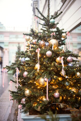Christmas trees decorated with Christmas balls on the city streets
