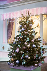 Christmas trees decorated with Christmas balls on the city streets
