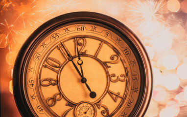 Close up of retro  clock on blurred Christmas and New Year background with bokeh