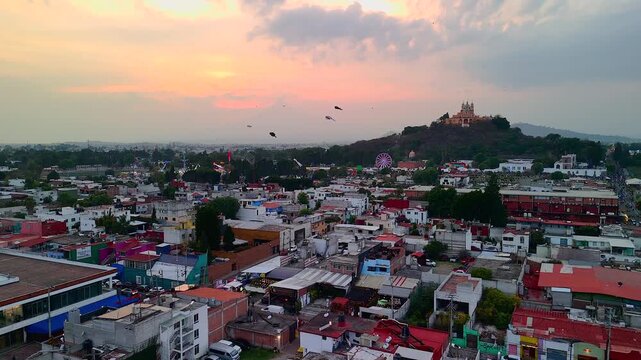 Drone over Cholula: colorful kites fill the sky