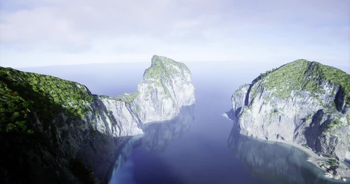 Towering green clad cliffs rise dramatically from calm blue waters, reflecting soft sunlight. The serene landscape offers a peaceful escape, showcasing the beauty of nature in harmony.