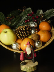 Christmas fruit basket with handmade clay figurine