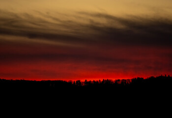 Dramatic sunset background with cloudy sky.