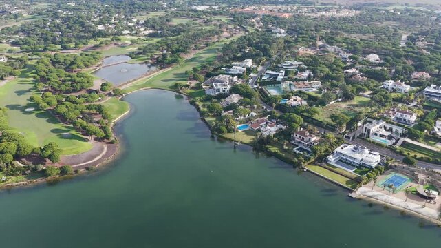 Exclusive Luxury Real Estate at San Lorenzo Golf Course: 4K Aerial View of Palatial Mansions, Private Infinity Pools, and Championship Fairways in Quinta do Lago, Algarve, Portugal