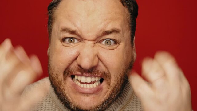 An angry man swears and shouts