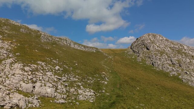 Aerial Drone Flight Over Bucegi Mountains Hiking Trail Revealing Panoramic View of Omu and Costila Peaks