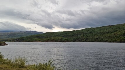 Langvatnet is a large freshwater lake in Norway, located in a remote mountainous landscape that also forms part of a former and active mining area. The surroundings combine natural beauty with industr
