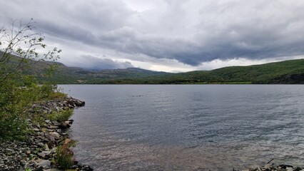 Langvatnet is a large freshwater lake in Norway, located in a remote mountainous landscape that also forms part of a former and active mining area. The surroundings combine natural beauty with industr