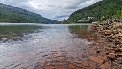 Langvatnet is a large freshwater lake in Norway, located in a remote mountainous landscape that also forms part of a former and active mining area. The surroundings combine natural beauty with industr