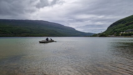 Langvatnet is a large freshwater lake in Norway, located in a remote mountainous landscape that also forms part of a former and active mining area. The surroundings combine natural beauty with industr