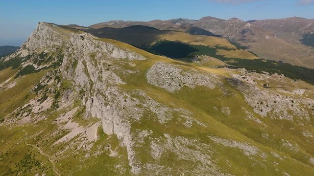 High Altitude Aerial Orbit of Bucegi Mountains Western Limestone Crest with Omu and Costila Peaks Background