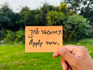 We are hiring trendy card post holding by hand, Join our team recruiting message, Drop your CV sticky note message, Vacancy here image