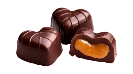 A chocolate heart with a yellow filling is cut in half