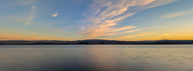 long exposure panorama of sunrise over Tomales Bay