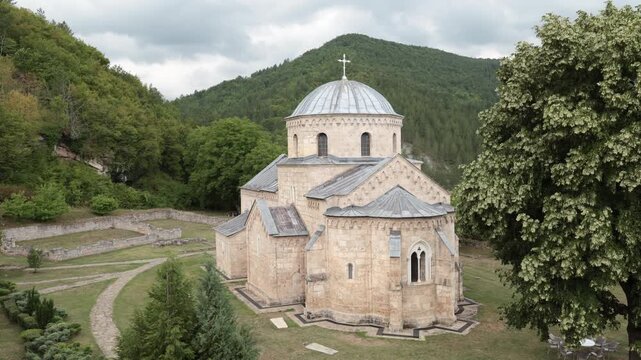 Central church building of Gradac monastery, Serbia. Austere design, sandstone walls, and narrow loophole windows represent religious European architecture of 14th century. 