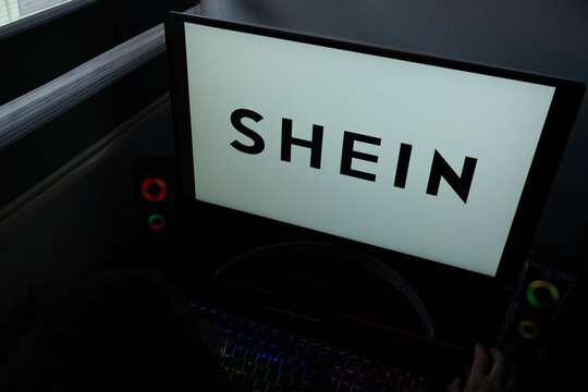 Punta Arenas, Chile &ndash; December 21, 2025: The SHEIN fast-fashion corporate wordmark is displayed on a computer monitor in a dark home office