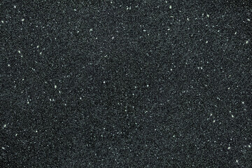 Cool silver grey glitter overlay background with scattered icy metallic specks on dark charcoal surface, frosty sparkling texture perfect for winter themes, elegant invitations, festive cards and mode