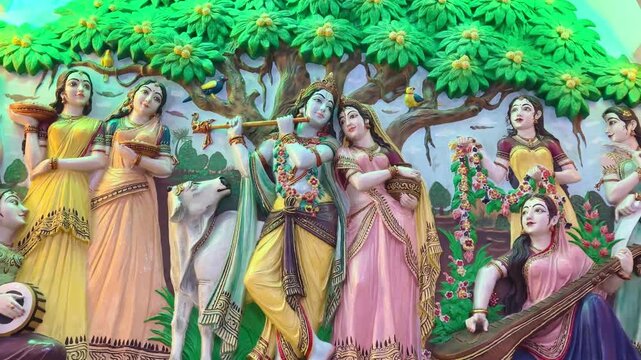 Lord Krishna and Radha surrounded by gopis beneath a lush kadamba tree, symbolizing divine love, harmony, and eternal devotion.